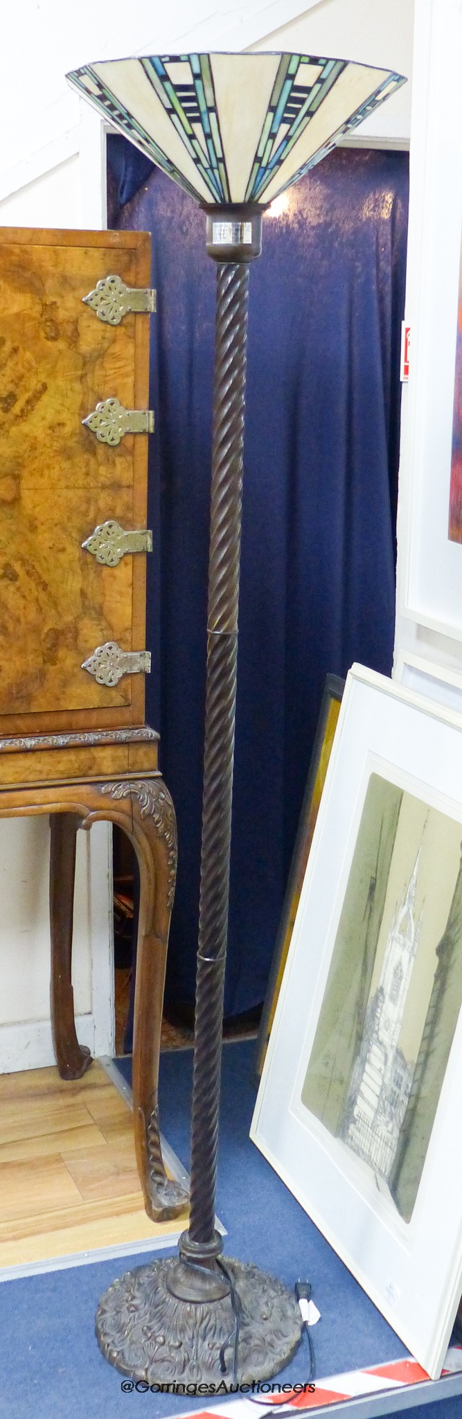 A Tiffany style bronzed metal standard lamp with stained glass shade, height 172cm